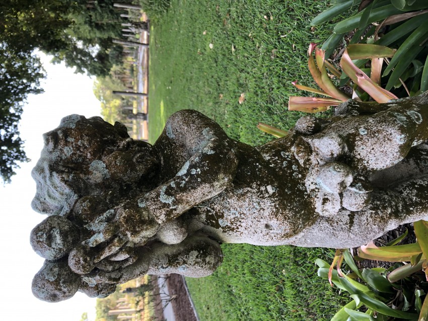 Figurine in the rose garden